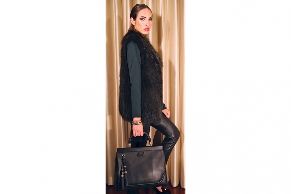 Creatures of Comfort
Erin takes a walk on the wild side in a fall-ready emerald fur vest, $1,795, cashmere and wool sweater, $295, and leather leggings, $1,150, all by Vince; a Gucci satchel, $2,650; and Kara Ross bracelet, $195.