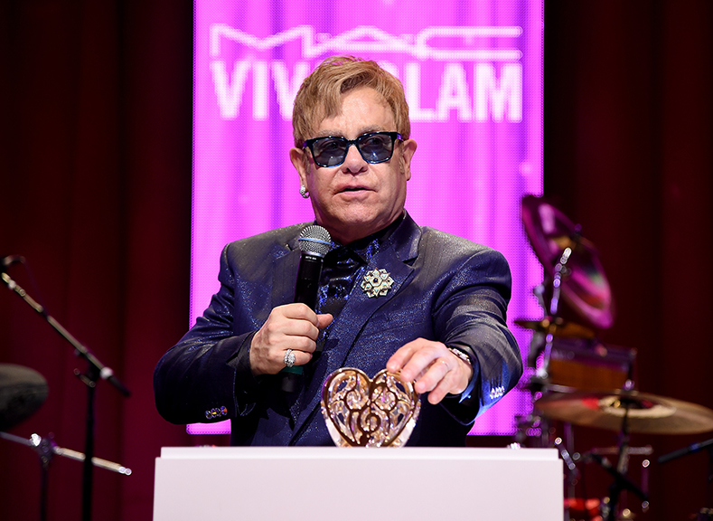 Elton John in Los Angeles, showcasing an Elton John Music Is Love For Lalique piece. Photograph courtesy Lalique.