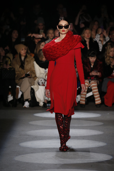 A textured crepe shawl collar dress paired with a scarf. Photograph courtesy Christian Siriano.
