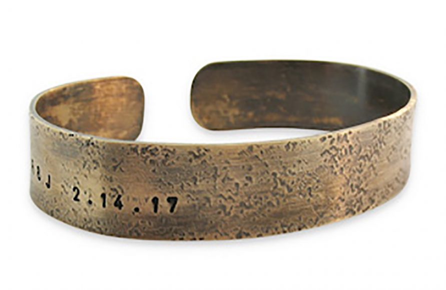 Men’s Personalized Wide Cuff, $78, pictured here as engraved with dates. Photograph courtesy Isabelle Grace Jewelry.