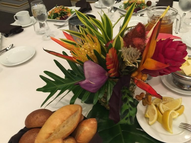 Centerpieces of island flowers in vases made of scooped-out pineapples put us all in a Hawaiian mood at the New York Botanical Garden’s press luncheon, as did a menu of Island-style red snapper and pineapple upside-down cake.
