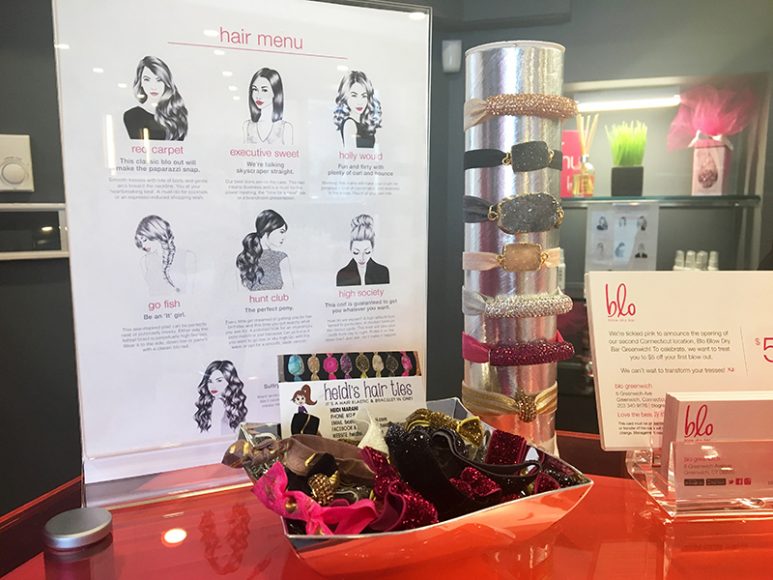 The hair menu, left, along with hair accessories available at the salon. Photograph by Danielle Renda.