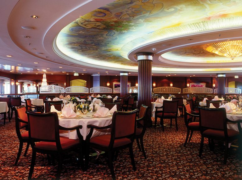 This Crystal Serenity dining room features a Chagall-like ceiling. Photograph courtesy Crystal Cruises.