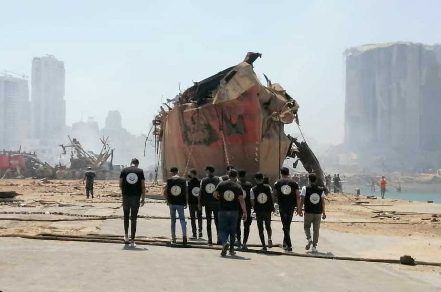 The aftermath of the Aug. 4 explosions in Beirut show the destroyed grain silo to the left and the flooded blast crater to the right. Courtesy Mehr News Agency.