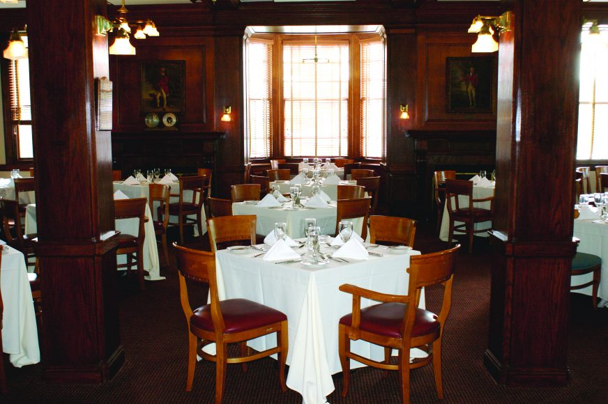 The Grill Room is a popular dining spot filled with historic images and club artifacts.