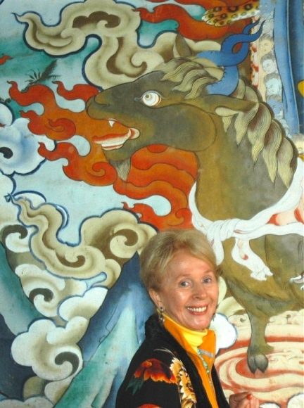 Audrey Topping before mural in Gangteng Monastery. Photograph by Kate Steichen.