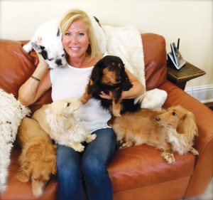 Dr. Erika Schwartz, one of WAG’s mainstays, cavorts with, clockwise from top left, Lola, Jasper, Henry, Heidi and Teddy. 