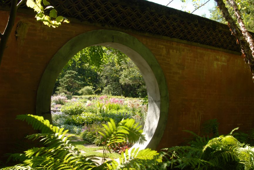 The iconic Moon Gate at The Abby Aldrich Rockefeller Garden in Seal Harbor, Maine, designed by Beatrix Farrand. Photograph by Rustin Dwyer. Courtesy The New York Botanical Garden.