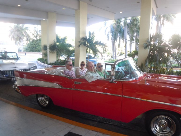 Richard and Barbara Dannenberg in a 1957 red Chevy convertible.