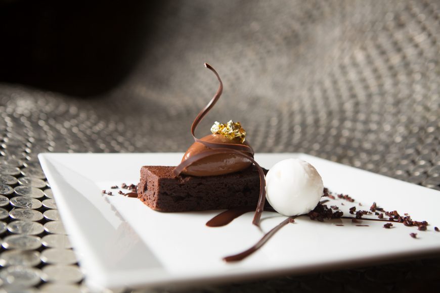 A dessert at The Four Seasons features Valrhona cake with coffee custard, tiramisu ice cream, chocolate ganache.