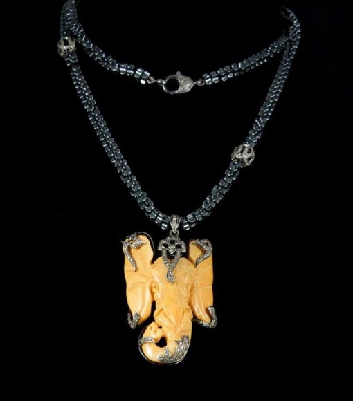 Bone and champagne diamond carved elephant necklace with champagne diamond beads, $2,562.