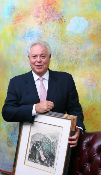 Art attorney Joel Lever with one of his Chagall prints before a Robert Natkin abstraction in his White Plains office.