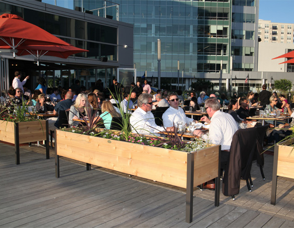 Diners enjoy the dockside dining area at Paloma.