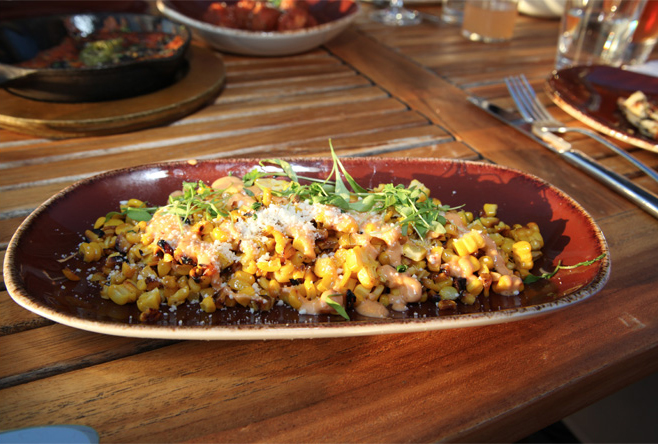 Mexican street corn appetizer made with chipotle crema, queso cotija and herbs.