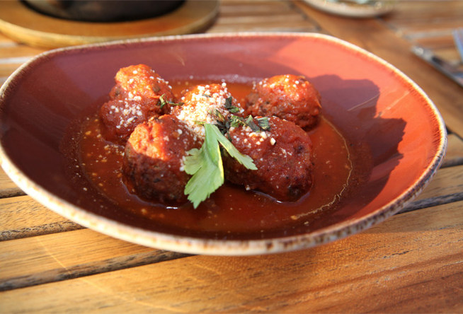 Albondigas appetizers made with chipotle broth, mint and queso cotija.