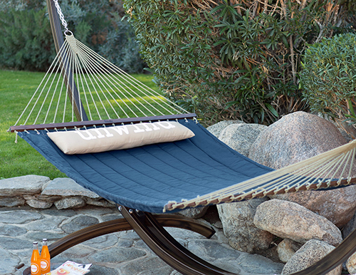 The Island Bay 13-foot Unwind Quilted Hammock with Faux Woodgrain Steel Stand. Photograph courtesy Hayneedle.