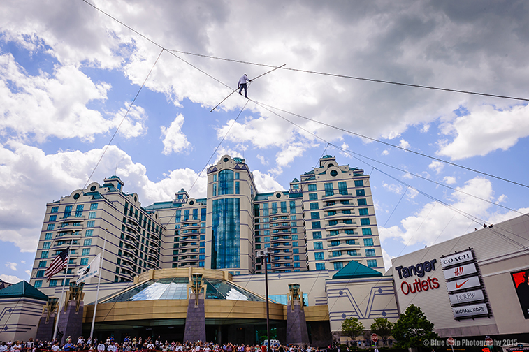 Nik Wallenda walking a 711-foot high-wire tightrope to celebrate the opening of the new Tanger Outlets Center at Foxwoods Casino & Resort on May 22. For every foot Wallenda walked, Foxwoods donated $7.11 worth of clothes from Tanger Outlets to the United Way of Southeastern Connecticut. Photograph by Bill Shettle of Blue Chip Photography.