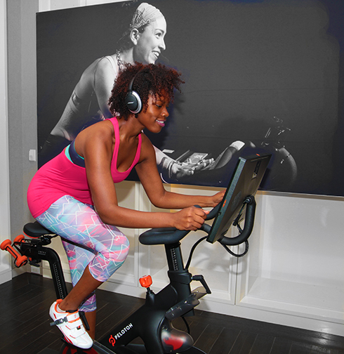 Micaiah Bell demonstrates the Peloton cycle in White Plains.