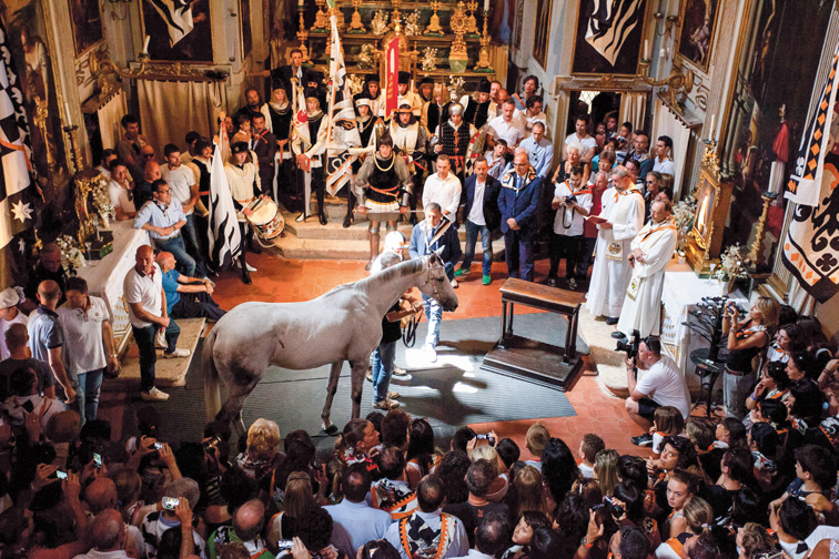 The blessing of the horse before the Palio of Siena. Image courtesy teNeues Publishing.