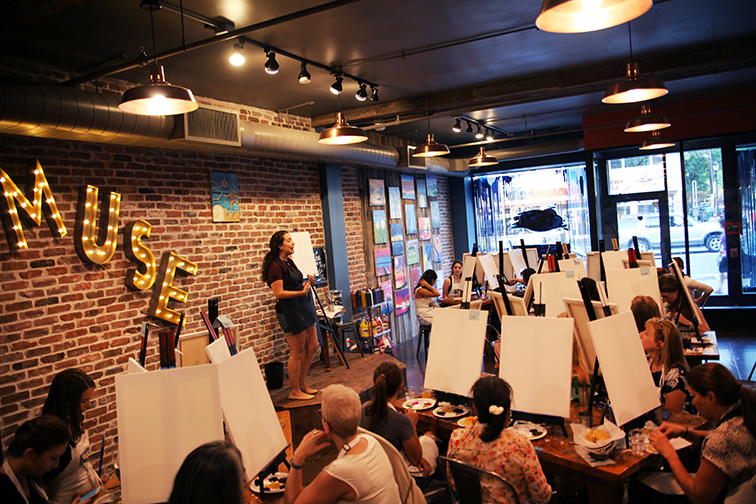 Budding artists participate in an evening class at Muse Paintbar in White Plains.