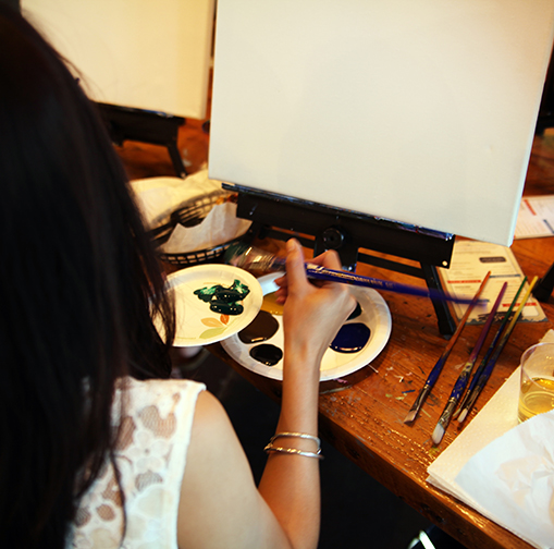 Budding artists participate in an evening class at Muse Paintbar in White Plains.