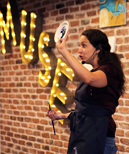 Carla Olexovitch leads a recent class at Muse Paintbar in White Plains.