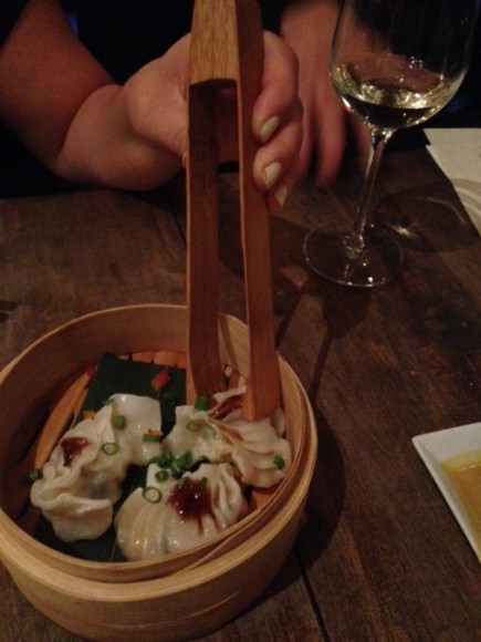 Organic vegetable dumplings served in a bamboo basket