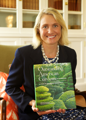 Garden Conservancy President and CEO Jenny du Pont with The Conservancy’s new book, “Outstanding American Gardens: A Celebration.” Photograph by Willow Buscemi.