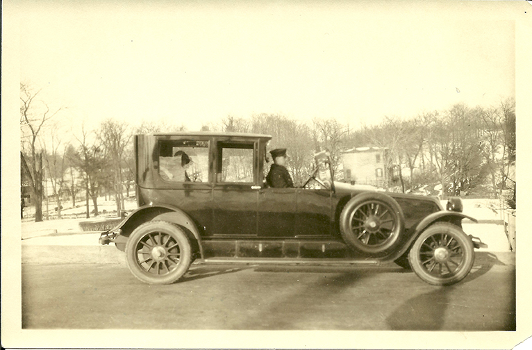 “The Stairs Below: The Mansion’s Domestic Servants, 1868-1938” opens Oct. 14 at the Lockwood-Mathews Mansion Museum. Here, Thomas Goggins, a Mathews family employee for more than 40 years, is seen driving Edith C. Mathews, circa 1920. Photograph courtesy of Rosemary Gillham.