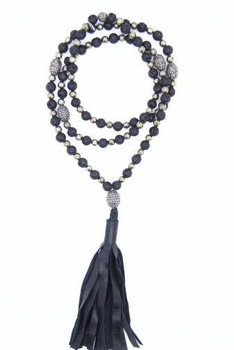 A necklace of pyrite and lava beads mixed with rhinestones in a double wrap-style with a chunky leather tassel.