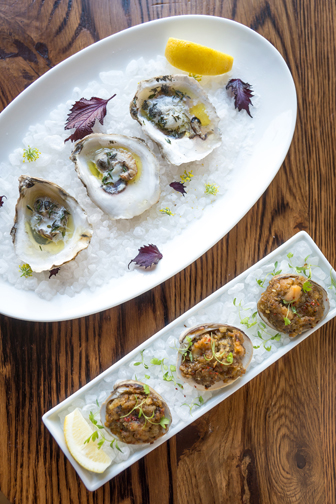 From the raw bar – grilled oysters with bubbling white wine, butter and thyme.