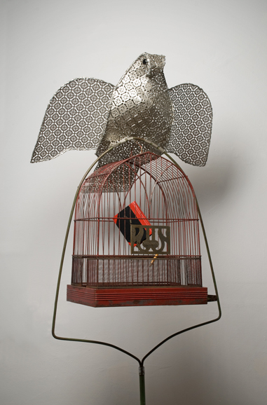 “Aviary 8: Chinese Journal,” aluminum mesh, standing metal cage, book, pencil, moss. Photograph by Howard Goodman, courtesy of the artist, Sarah Haviland.