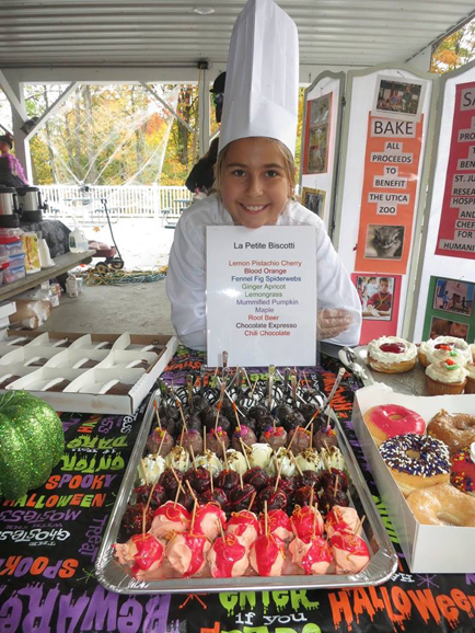 Grace LaFountain uses her passion for cooking on Make A Difference Day to hold a bake sale at the Utica Zoo to raise money for Chefs for Humanity, an organization dedicated to nutrition and fighting hunger.