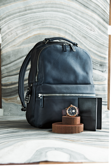 Shinola leather accessories for men at Neiman Marcus include a backpack, passport wallet and watch. Photograph courtesy of Neiman Marcus.