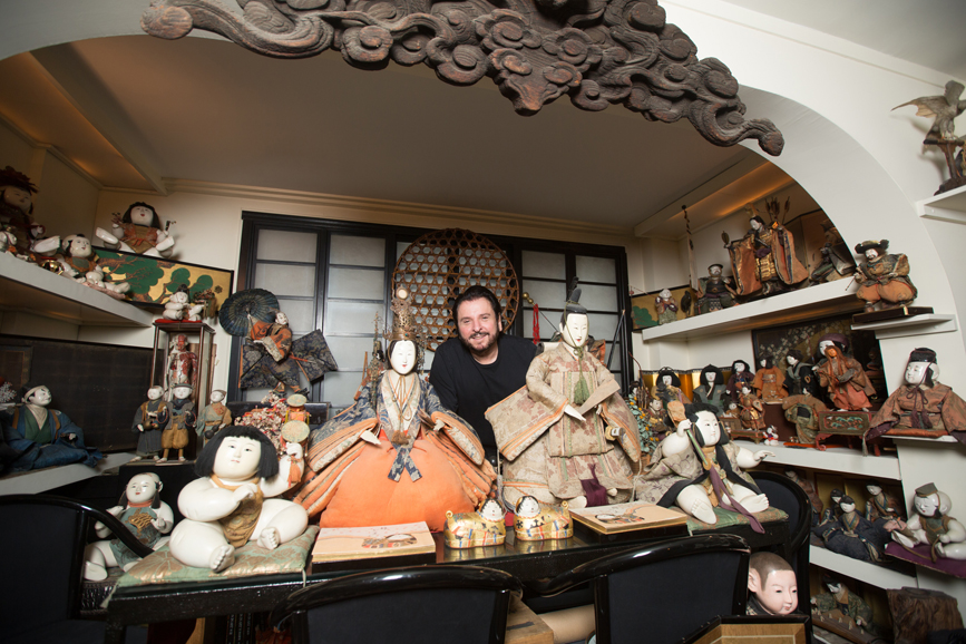 Michael Ayervais stands amongst his collection of Japanese Ninyô. Photo from September 2015. Photograph by John Rizzo.