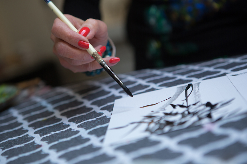 Carol Pessin creates art cards in her studio. Photo from May 2015. Photograph by John Rizzo.