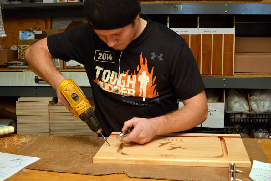 Keith Bennett works on a custom cutting board at Soundview Millworks. Photograph by Bob Rozycki.