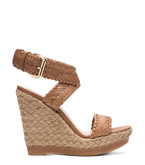 A hand-braided jute sole adds a Bohemian touch to Stuart Weitzman’s Elixir Wedge ($455), shown here in Adobe Nappa Leather. Photograph courtesy Stuart Weitzman.