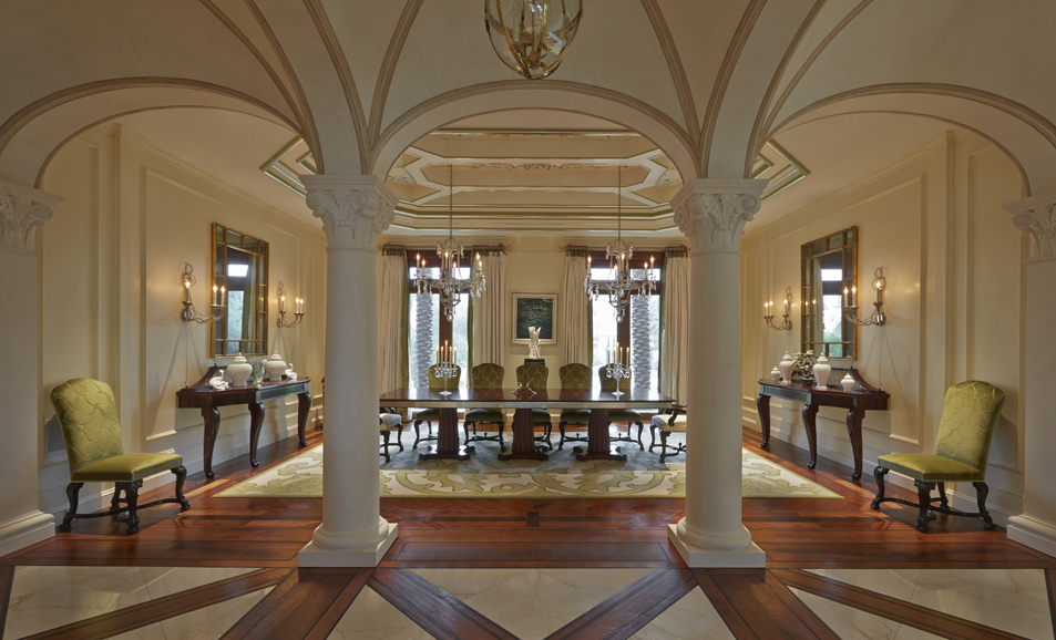 The dining room table and sideboards all feature elements based on Robert Adam’s designs. They are framed by three spectacular double-barrel vaults. Photography by Ray Main.