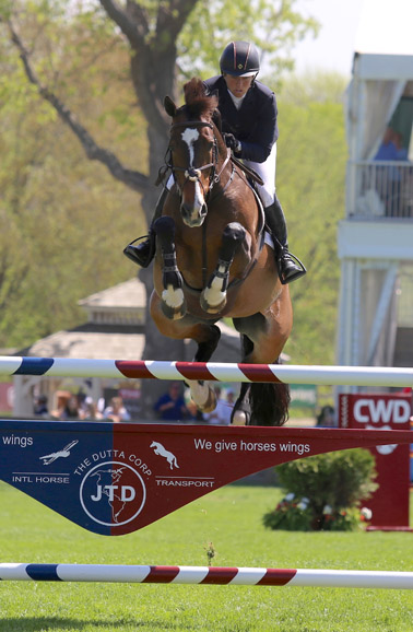 Beezie Madden and Vanilla fly during the Old Salem Farm Spring Horse Shows. Photograph by Lindsay Brock for Jump Media.