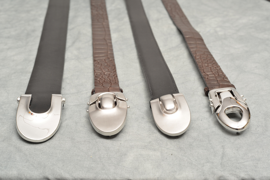 A closeup of the belts available in Brian Toohey's men's collection. According to Toohey, the buckles give off an automotive-like feel. Photograph by Bob Rozycki.