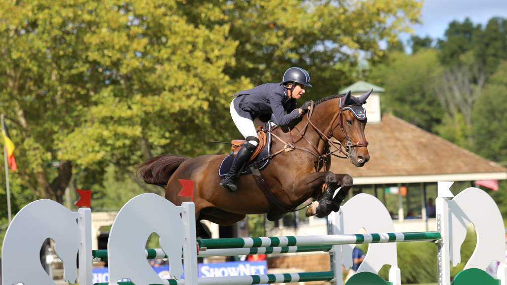 Laura Kraut and Deauville S competing at Old Salem Farm. Photograph by Lindsay Brock for Jump Media.