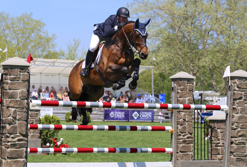 McLain Ward and HH Carlos Z show off in front of the crowd at Old Salem Farm. Photograph by Lindsay Brock for Jump Media.