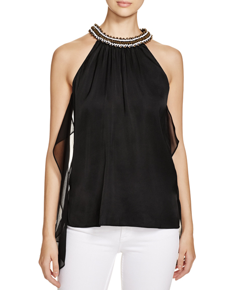 Florence Beaded Neck Stretch Silk Top in black, ($348). Photograph courtesy of Bloomingdale’s.