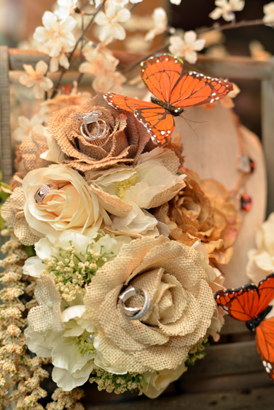 A close-up view of the detail in Rimedio's custom-designed case, featuring rings from Landsberg Jewelers, delicately placed on faux flowers made from burlap. Photograph by Bob Rozycki.
