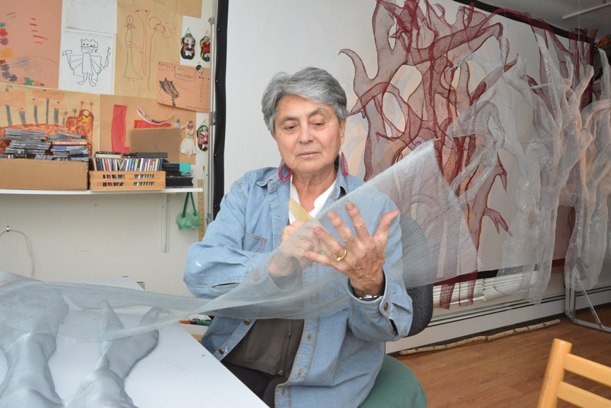 Kaya Deckelbaum demonstrates her technique, in her Hastings-on-Hudson studio. Photograph by Bob Rozycki.