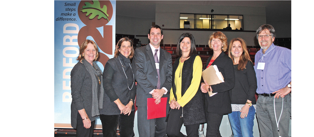 From left, Bedford 2020 co-founder Ellen Conrad,  executive director Midge Iorio, advisor Drew Patrick, board member Karen Sabath, co-founders Olivia Farr and Mary Beth Kass and task force member Nick Gutfreund. Photograph by Lauren Brois.