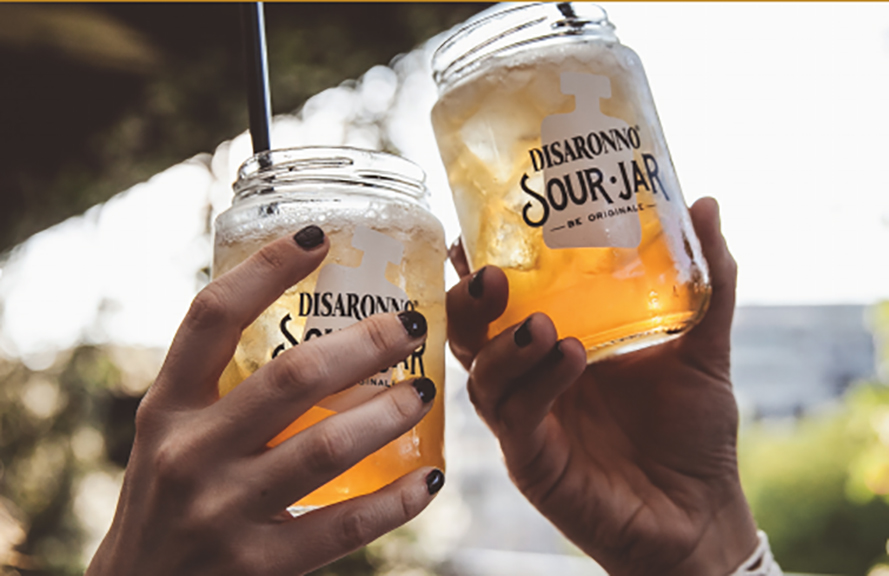 Mix up your warm-weather entertaining by serving a Disaronno Sour in a Mason jar. Courtesy Disaronno.