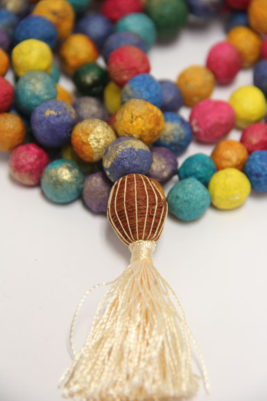 Mala necklace, hand-beaded and colored with vegetable dyes, from Jewelry for a Cause.  Photograph by Elizabeth Kirkpatrick for Mama Jane’s Global Boutique.