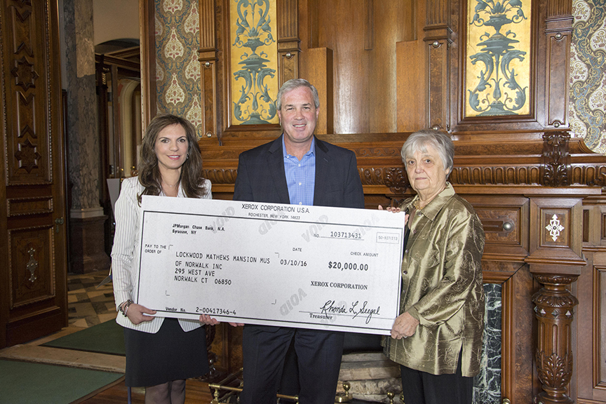 The Lockwood-Mathews Mansion Museum in Norwalk recently received a grant from The Xerox Foundation. Here, from left, LMMM Executive Director Susan Gilgore, Xerox Foundation President Mark Conlin and Patsy Brescia, LMMM chairman of the Board of Trustees. Photograph courtesy of Sarah Grote Photography.
